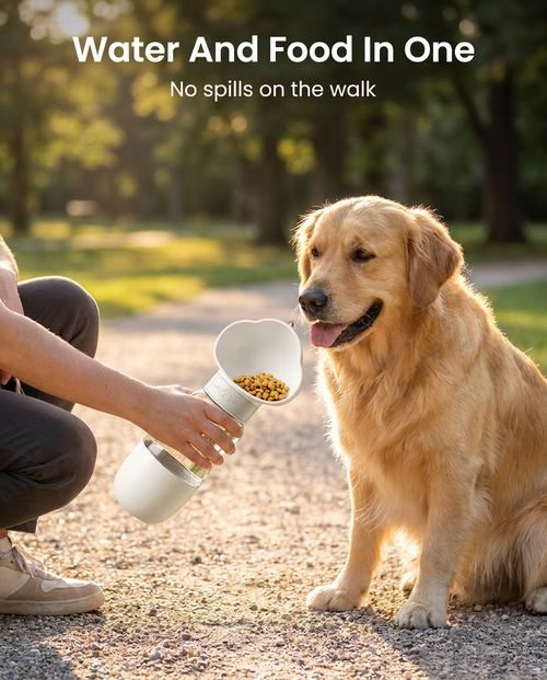 Dog drinking from the 2-in-1 travel water bottle and food cup on a walk