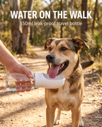 Dog drinking from the white 550ml portable pet water bottle