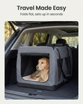 Dog resting in the medium grey soft travel crate in a car boot