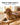 White cordless pet clipper being used to groom a dog at home