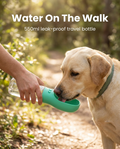 Dog drinking from the green 550ml portable pet water bottle